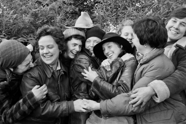 Still from film Outliers and Outlaws. Group hug. Credit Meadow Muska.